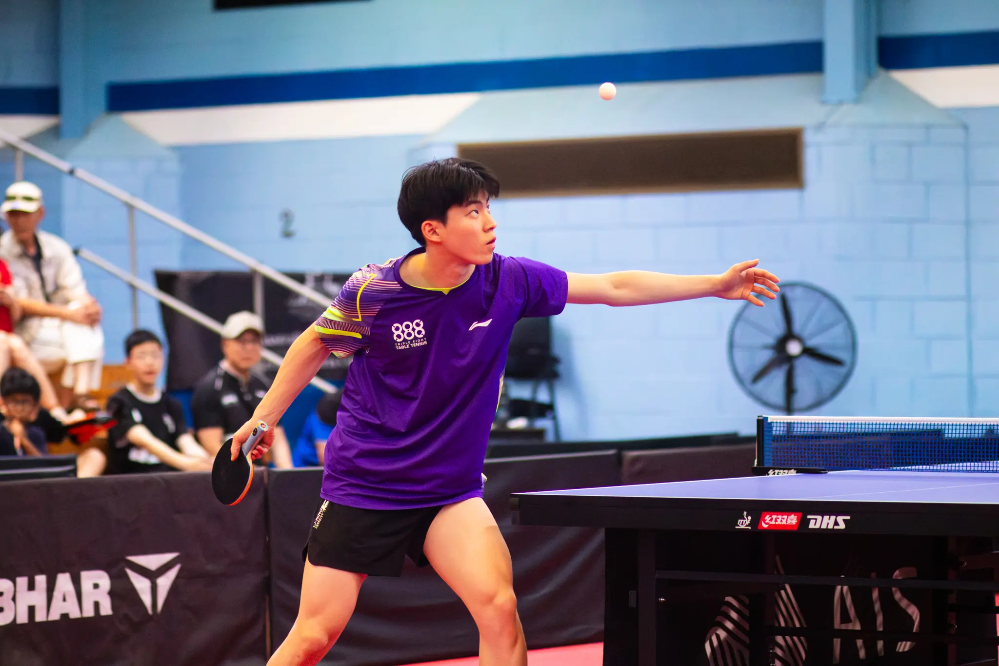 Hwan Bae returning a shot at the table during match play